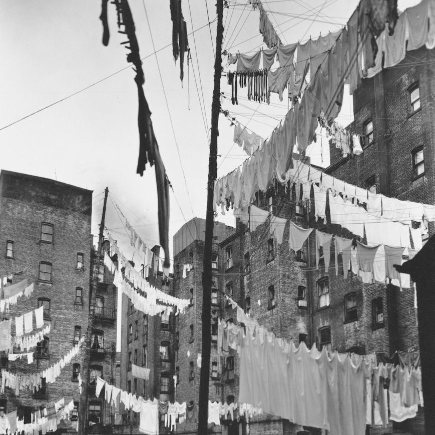 Laundry and Ironing drying on multiple washing lines, showing a hectic build up of laundry.