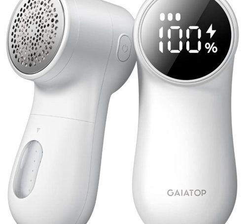 Handheld fabric shaver with LED display indicating battery life.